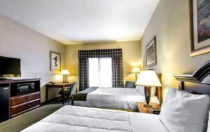 Hotel room with two queen beds and desk
