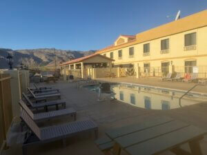 Hotel pool courtyard with mountain backdrop