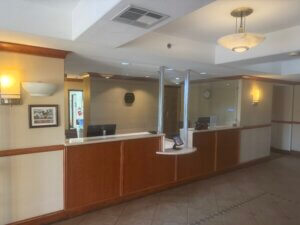 Hotel reception desk with protective glass