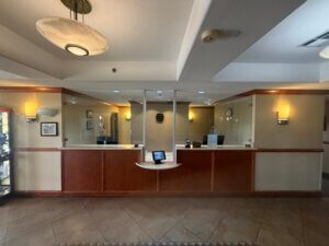 Hotel reception desk with protective screens