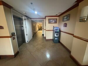 Hotel corridor with ATM and elevator