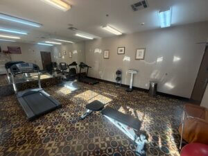 Small hotel fitness room with treadmill