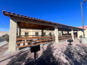 Hotel patio with wooden railings and grills